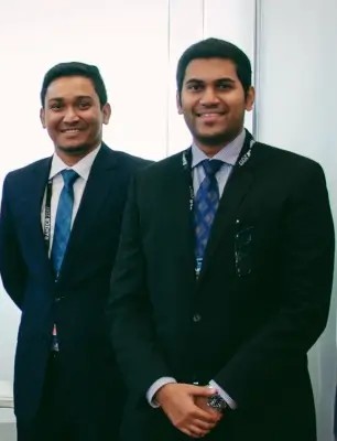 Two QUBS team members standing together